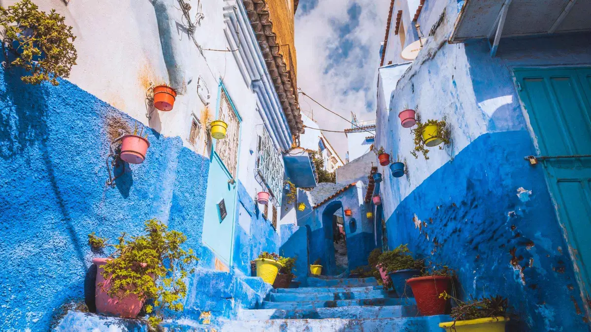 Blue-washed steps in the old town of Chefchaouen on a 4-day imperial cities Morocco tour package, Chefchaouen, Morocco