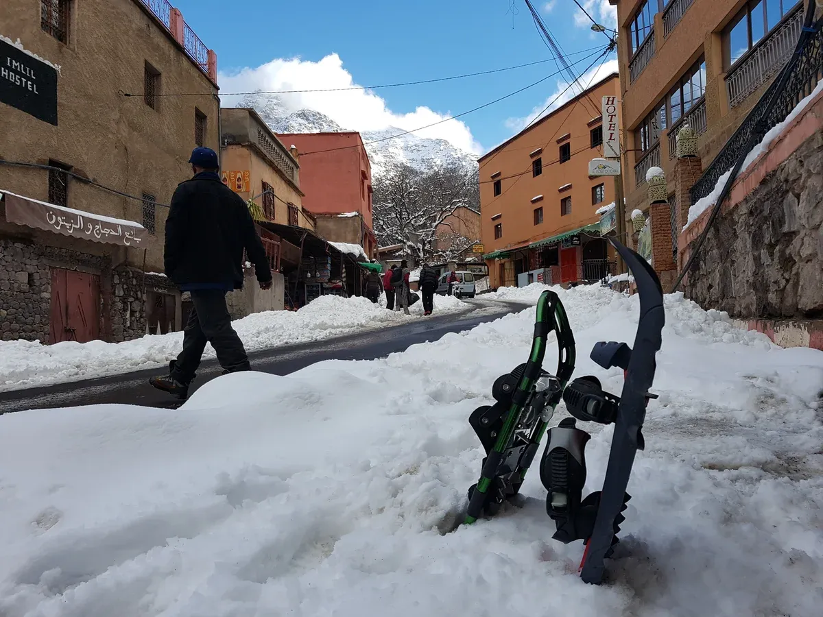 Snow on the street of a High Atlas village in winter on a Morocco tour package, High Atlas village in winter, Morocco