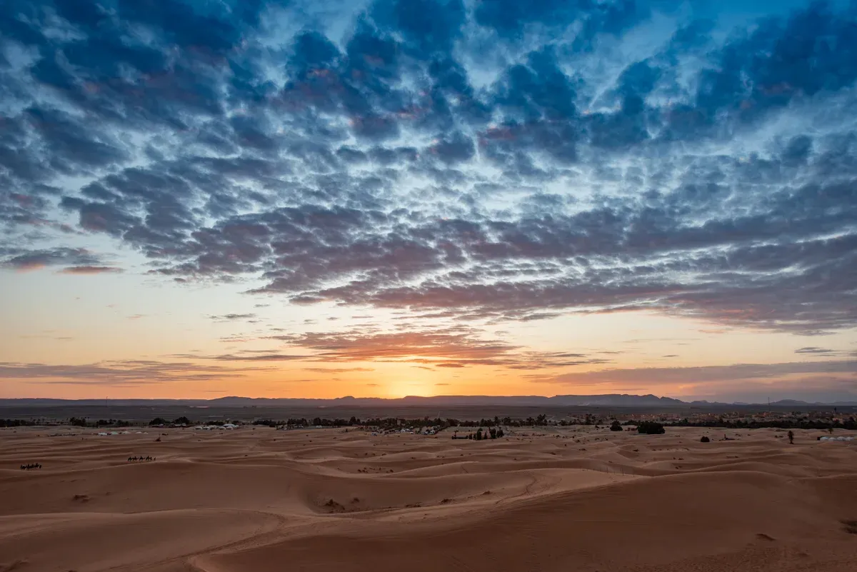 Sunset over the Erg Chebbi dunes near Merzouga on a Morocco tour package, Erg Chebbi, Merzouga, Morocco