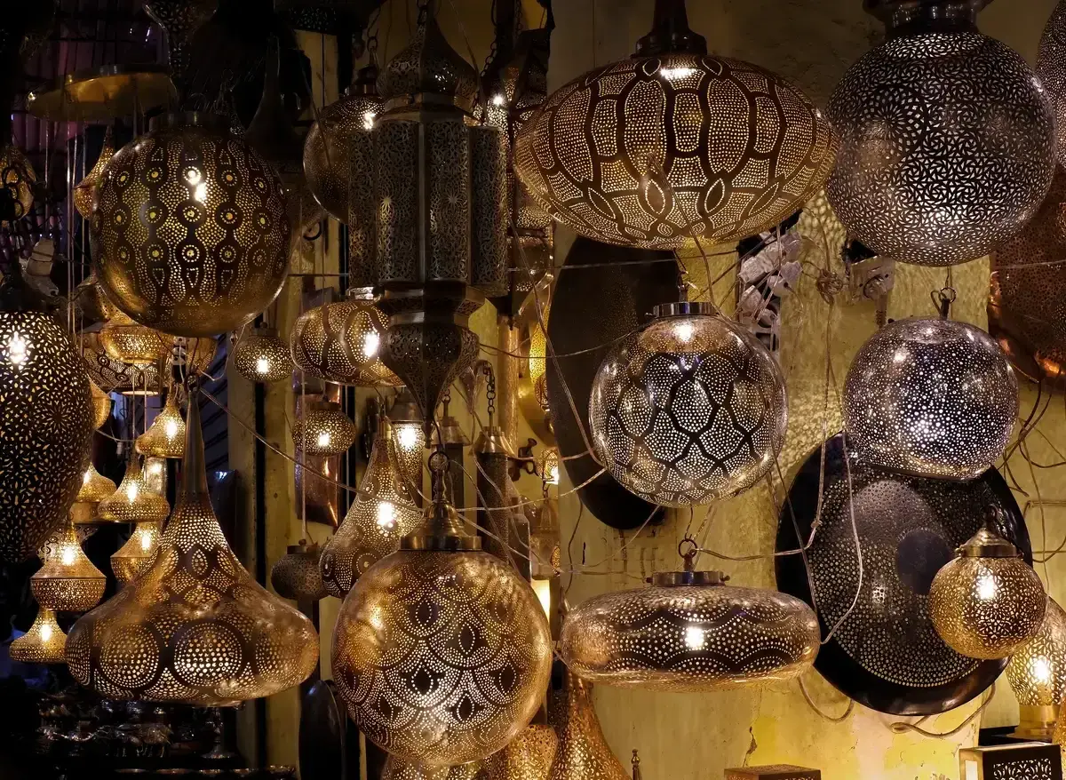 Metal lanterns hanging in a Marrakech medina souk on a Morocco tour package, Marrakech souk, Morocco