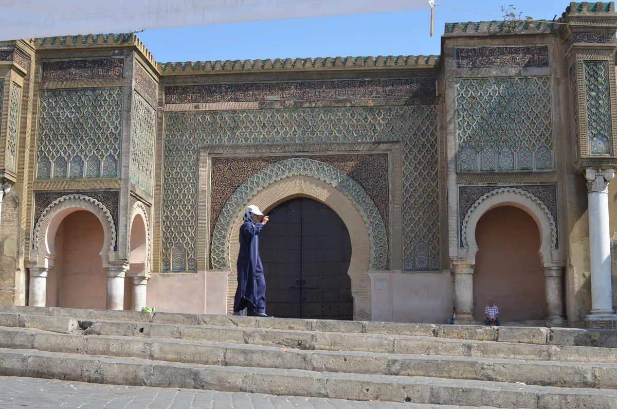 The tiled gate of Bab Mansour in the imperial city of Meknes on a Morocco tour package, Bab Mansour gate, Meknes, Morocco