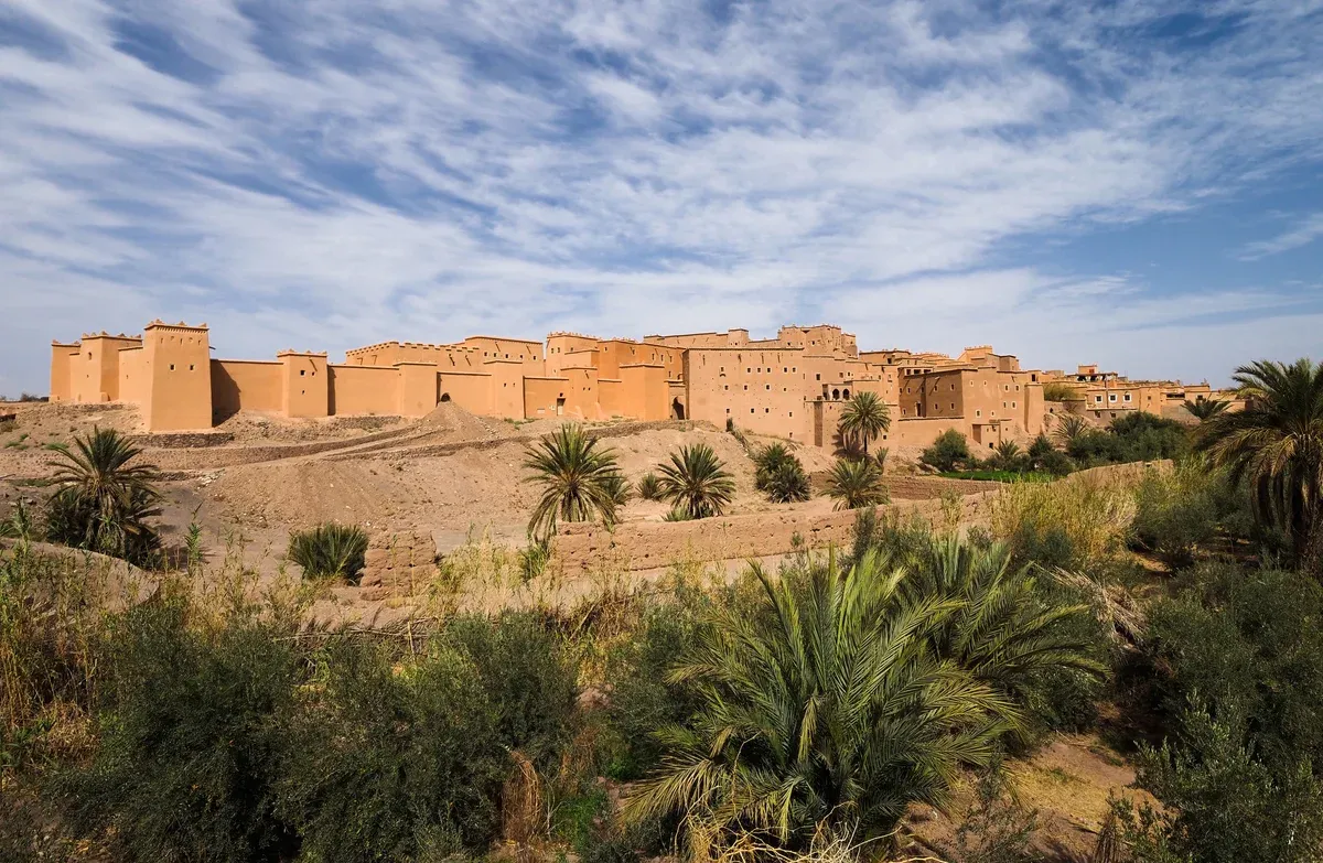 Taourirt Kasbah above palm gardens in Ouarzazate on a Morocco tour package, Taourirt Kasbah, Ouarzazate, Morocco